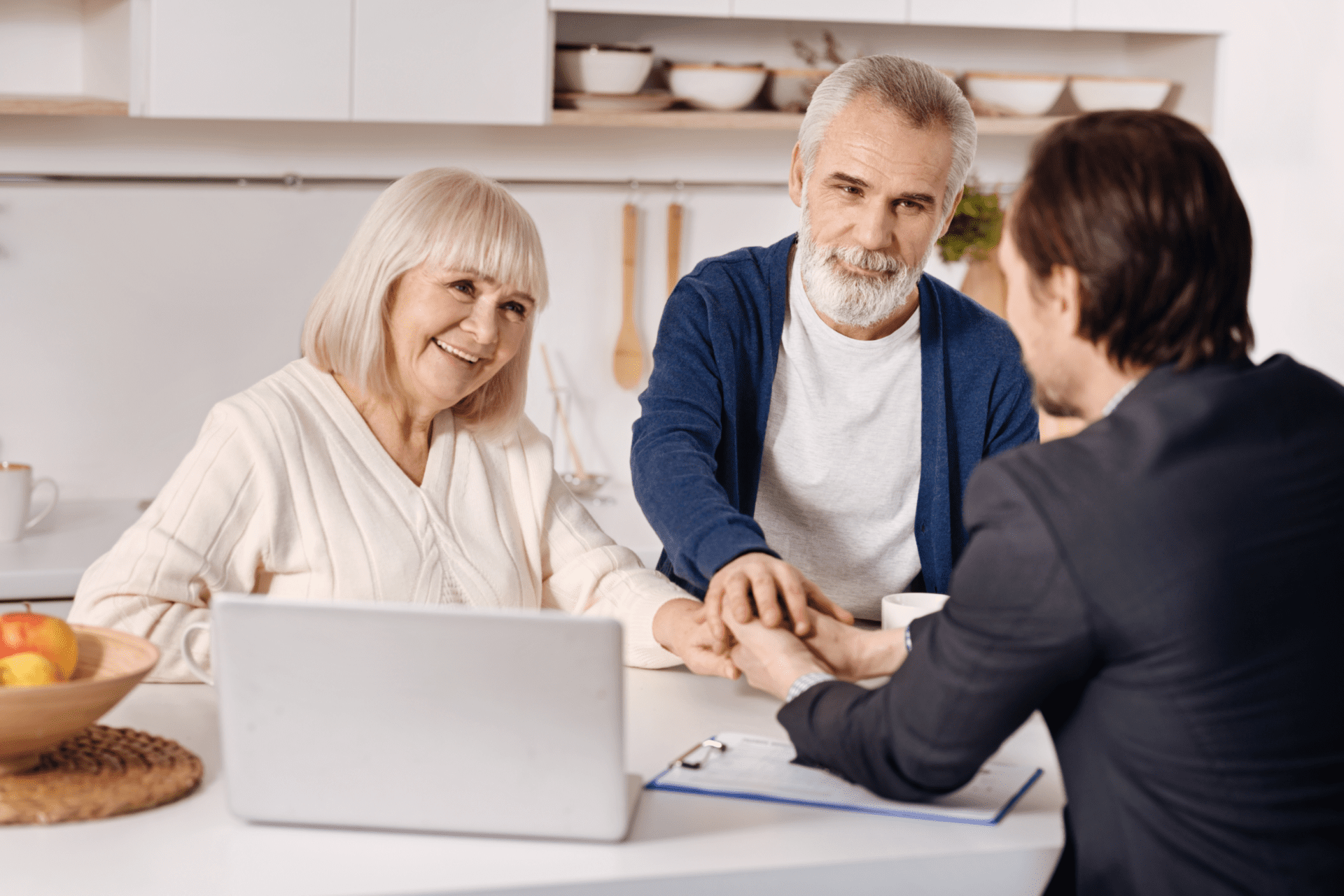 Real estate agent meeting with elderly couple of customers Real estate agent meeting with elderly couple of customers