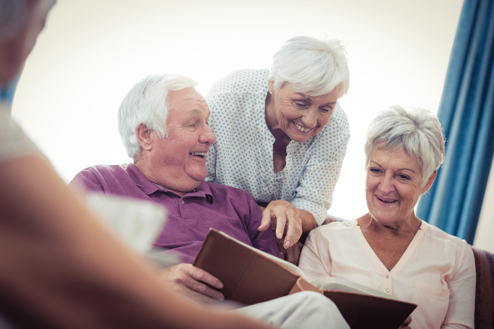 Seniors looking at pictures in the retirement house Seniors looking at pictures in the retirement house